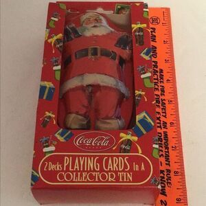 New old stock, bicycle playing cards by Coca-Cola and collectible Santa tin
